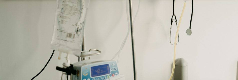 a hospital room with a bed and medical equipment