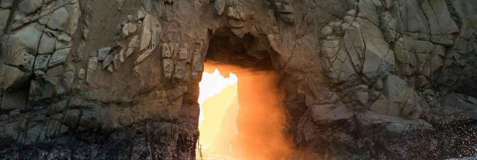 waves crashing rocks during daytime