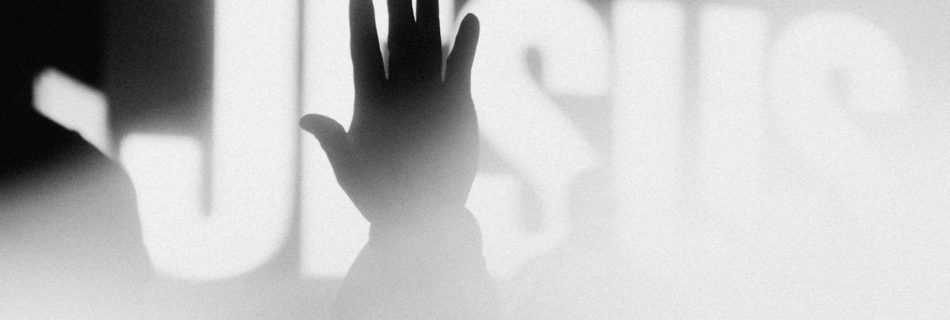 a person's hand reaching up into the air