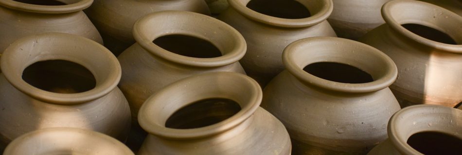 A bunch of vases that are sitting on a table