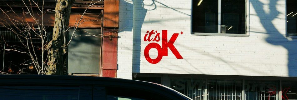 a van is parked in front of a building