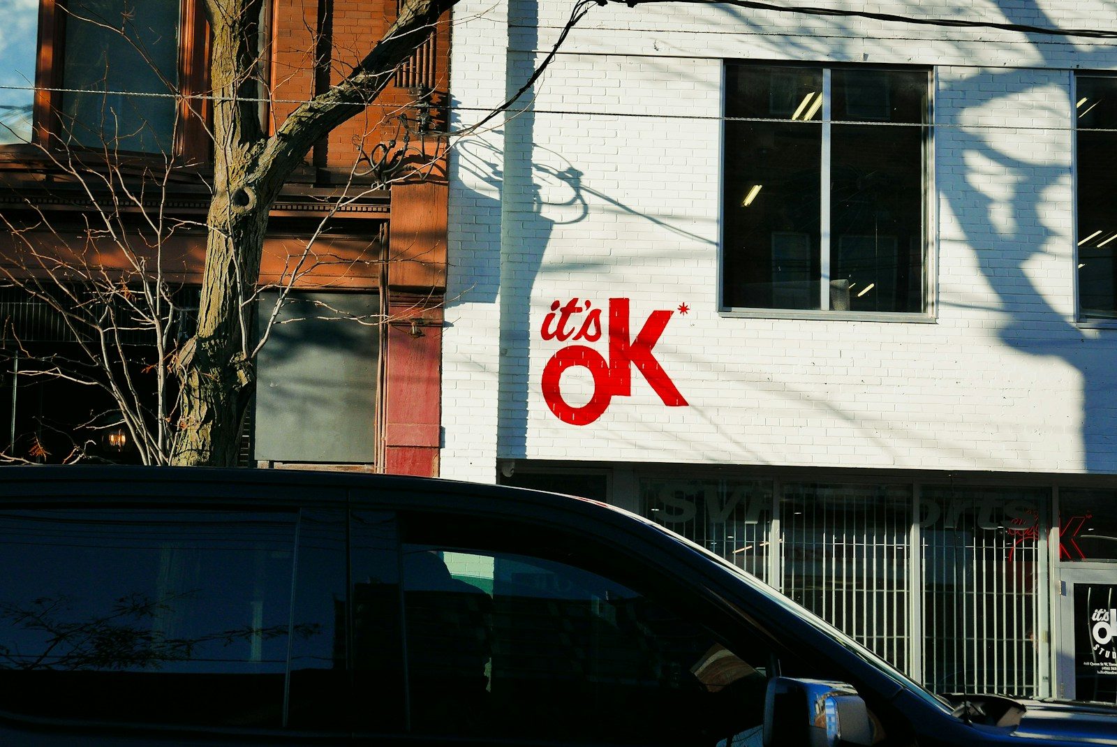 a van is parked in front of a building